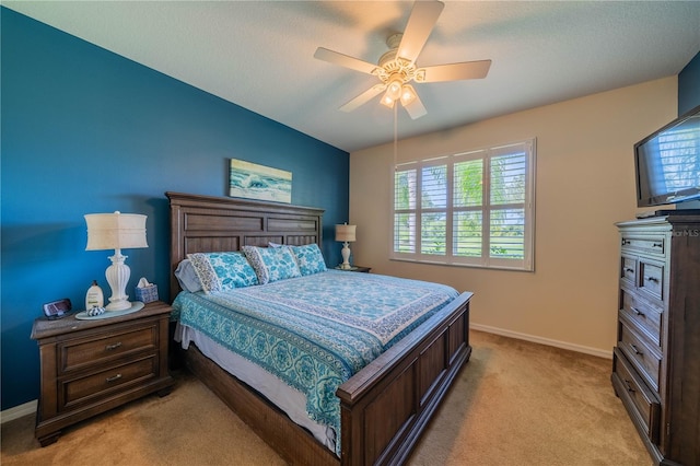 bedroom with light colored carpet and ceiling fan