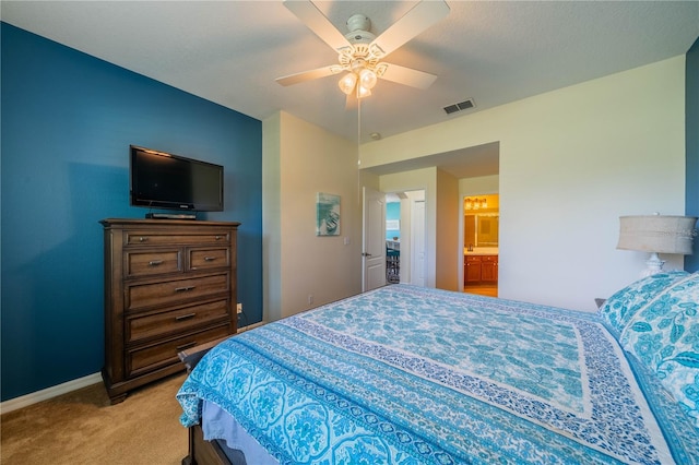 bedroom with ceiling fan and light carpet