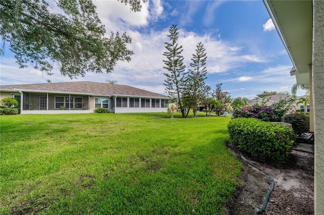 view of yard with a sunroom