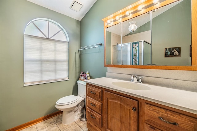 bathroom featuring lofted ceiling, toilet, an enclosed shower, and a healthy amount of sunlight