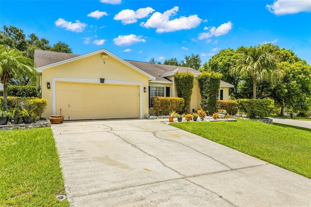 ranch-style home with a garage and a front lawn