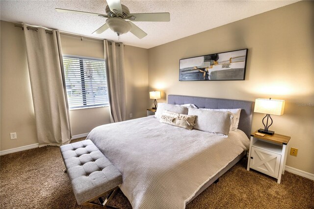 carpeted bedroom featuring a textured ceiling and ceiling fan