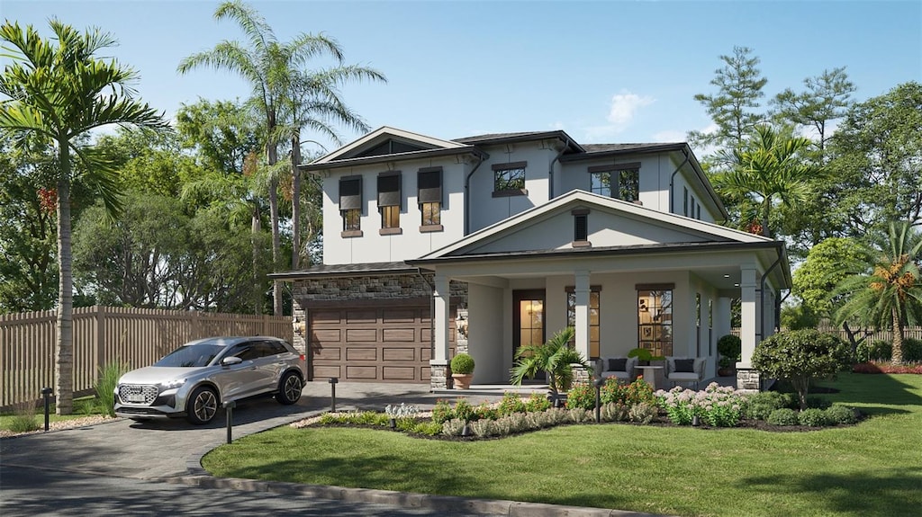 view of front of home with a garage and a front lawn