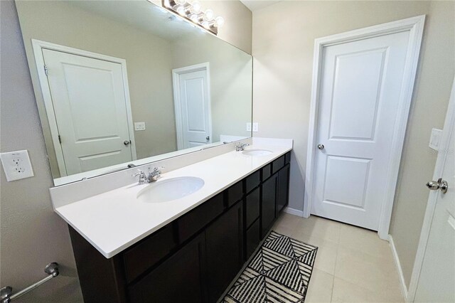 bathroom featuring double sink vanity and tile patterned flooring