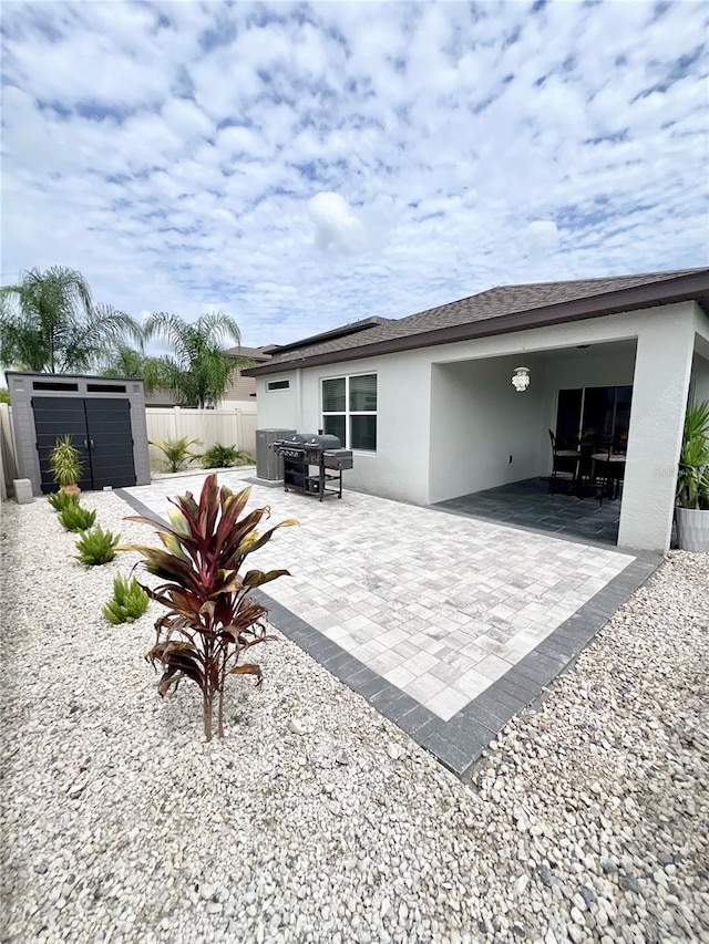 rear view of house featuring a patio area