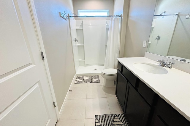 bathroom featuring a shower with shower curtain, vanity, toilet, and tile patterned flooring