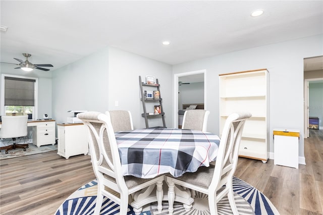 dining room featuring ceiling fan and hardwood / wood-style floors