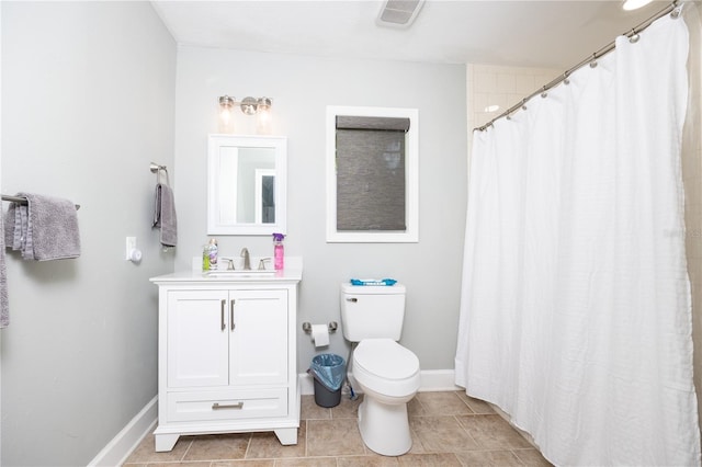 bathroom featuring vanity, a shower with shower curtain, tile patterned floors, and toilet