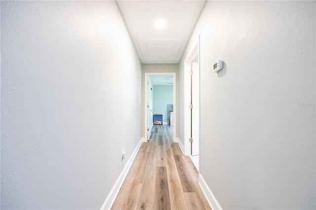 corridor featuring light hardwood / wood-style floors