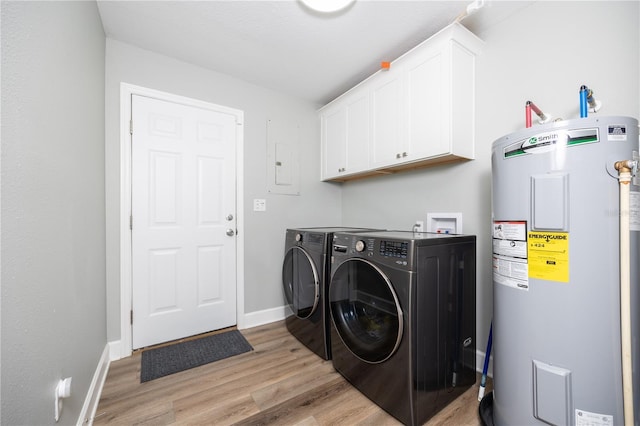 clothes washing area with cabinets, separate washer and dryer, electric water heater, and light wood-type flooring