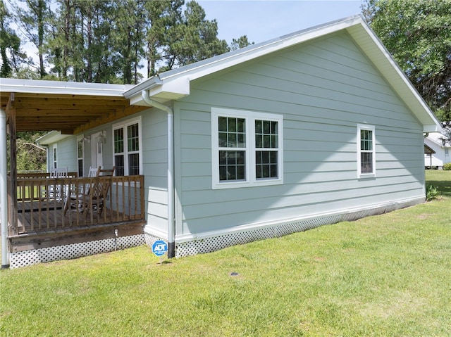 view of home's exterior featuring a yard