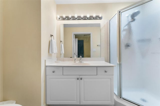 bathroom with vanity and an enclosed shower