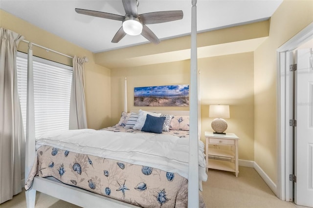 bedroom featuring light colored carpet and ceiling fan