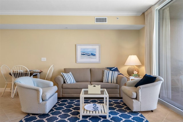 living room featuring tile patterned floors and crown molding