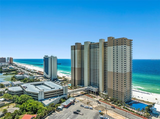 aerial view featuring a water view and a beach view