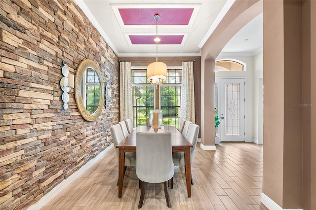 dining space with an inviting chandelier and crown molding