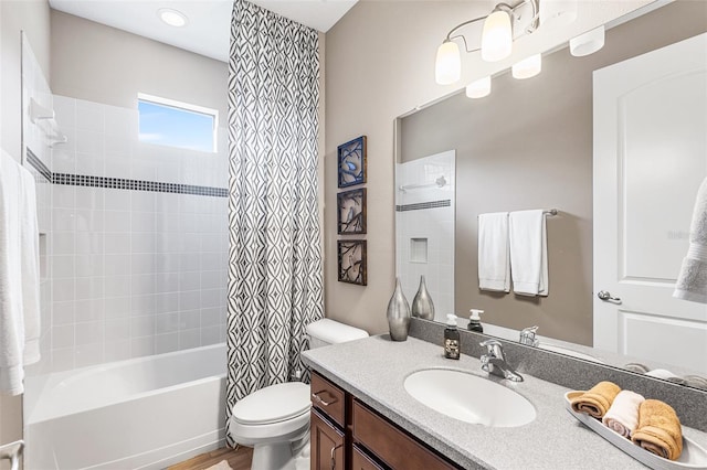 full bathroom with shower / bath combo, vanity, and toilet