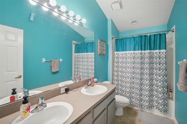 full bathroom featuring toilet, shower / tub combo, and vanity