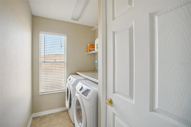 laundry room featuring separate washer and dryer