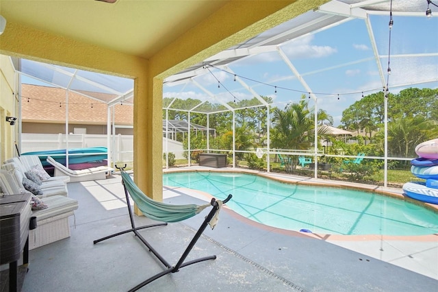 view of pool featuring a lanai and a patio area