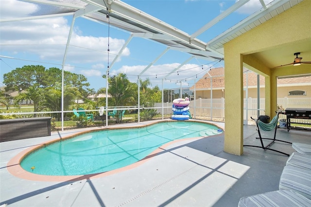 view of pool featuring a lanai, a grill, and a patio