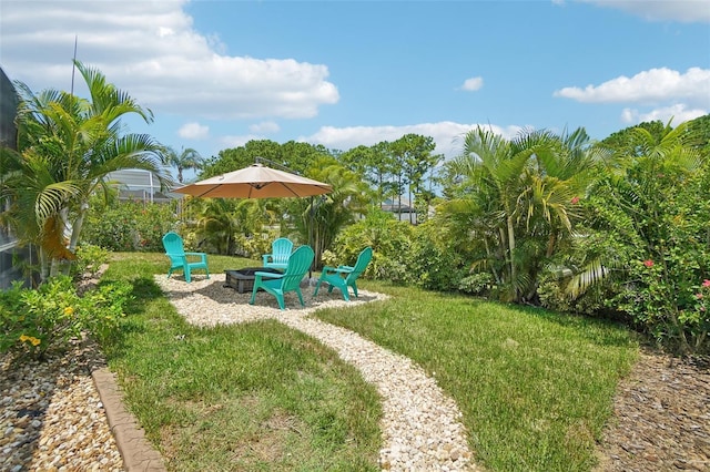 view of yard with a fire pit