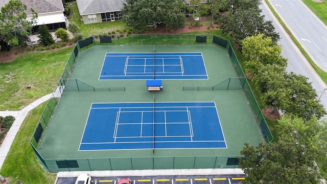 view of tennis court with basketball hoop