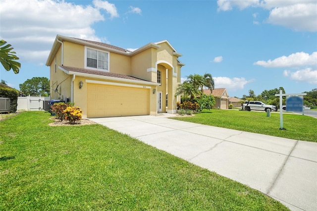 view of front of house with a front yard and a garage