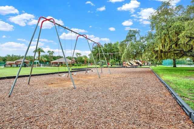 exterior space with a lawn and a playground