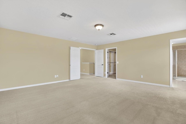 spare room with light colored carpet