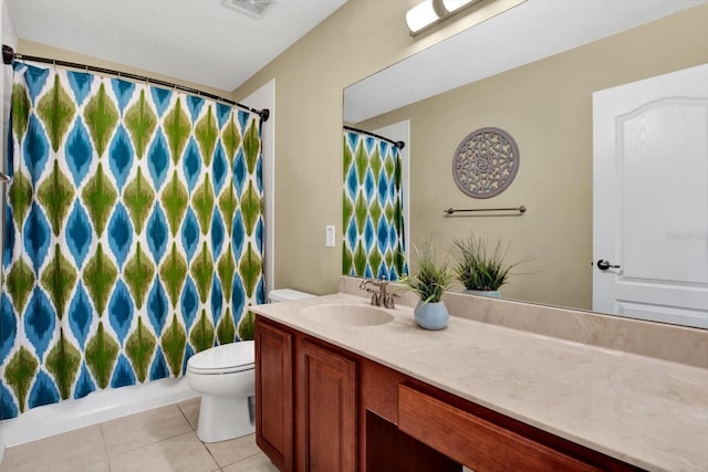 full bathroom featuring toilet, vanity, shower / tub combo, and tile patterned floors