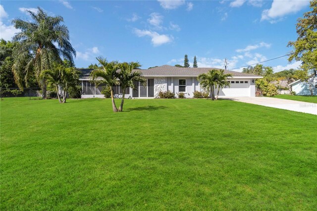 single story home with a garage and a front lawn