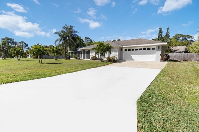 single story home with a front lawn and a garage