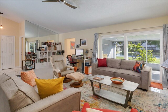 tiled living room with ceiling fan