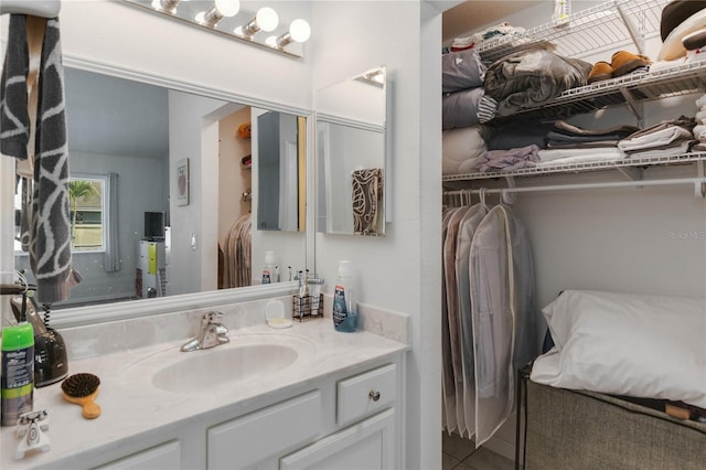 bathroom with tile patterned floors and vanity