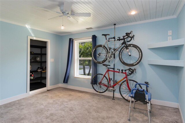 rec room with ceiling fan, light carpet, and ornamental molding