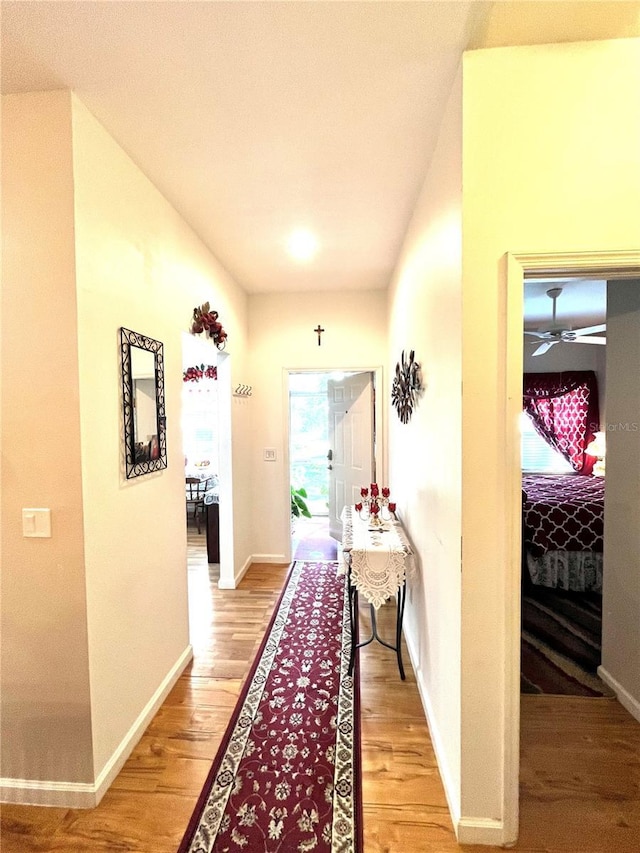 35226 Janine Dr, Zephyrhills, FL 33541 - corridor featuring baseboards and light wood-type flooring