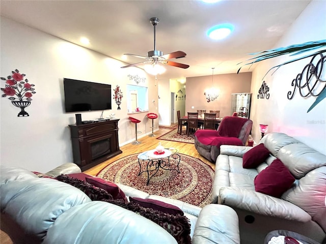 35226 Janine Dr, Zephyrhills, FL 33541 - living area featuring light wood finished floors, ceiling fan, and baseboards