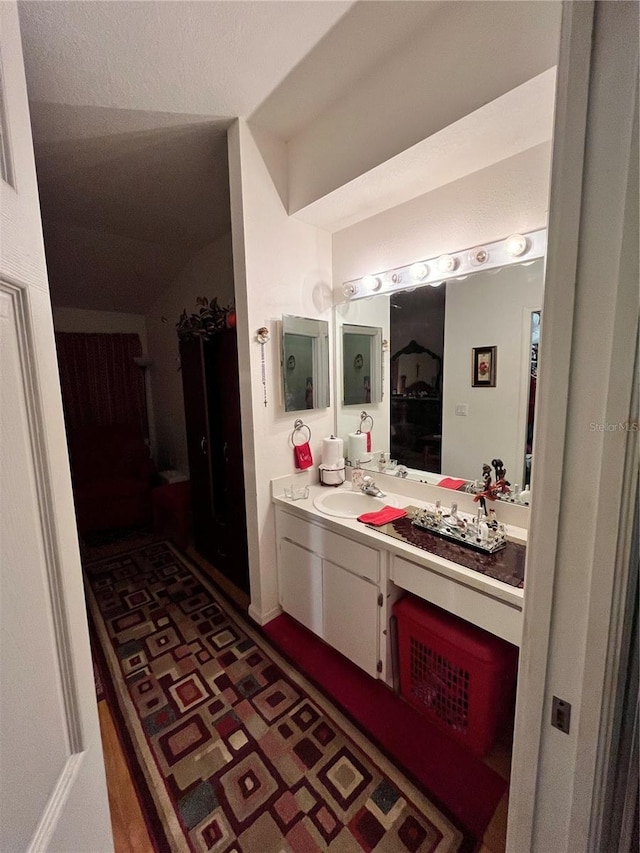 35226 Janine Dr, Zephyrhills, FL 33541 - bathroom with vanity and lofted ceiling