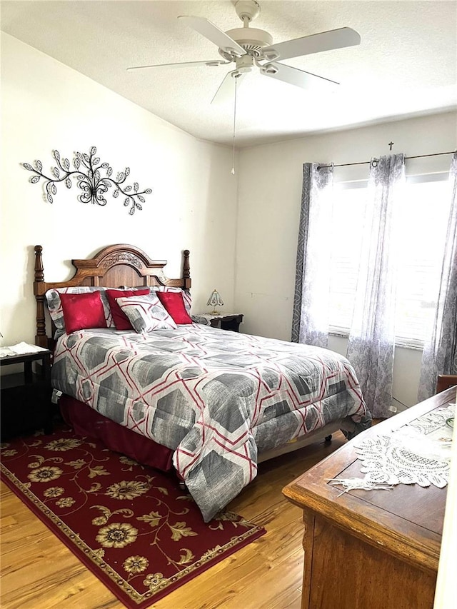 35226 Janine Dr, Zephyrhills, FL 33541 - bedroom featuring wood finished floors, ceiling fan, and a textured ceiling