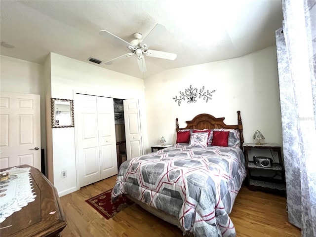 35226 Janine Dr, Zephyrhills, FL 33541 - bedroom featuring wood finished floors, vaulted ceiling, a closet, and a ceiling fan