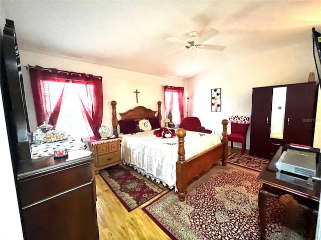 35226 Janine Dr, Zephyrhills, FL 33541 - bedroom featuring multiple windows, light wood-style floors, lofted ceiling, and ceiling fan