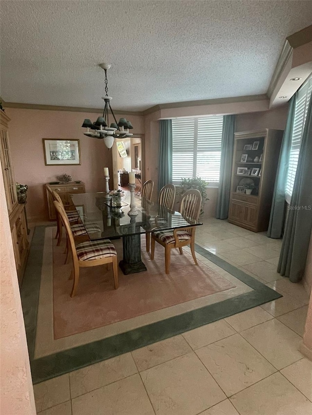 tiled dining space with crown molding, an inviting chandelier, and a textured ceiling