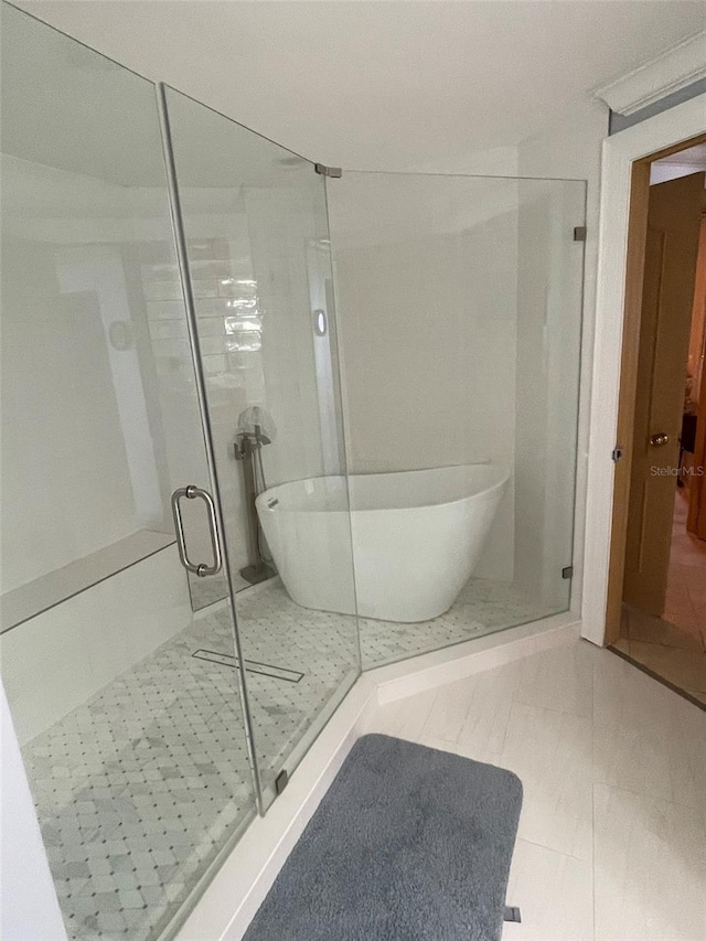 bathroom with separate shower and tub