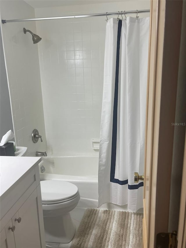 full bathroom with shower / bath combo with shower curtain, toilet, tile patterned flooring, and vanity