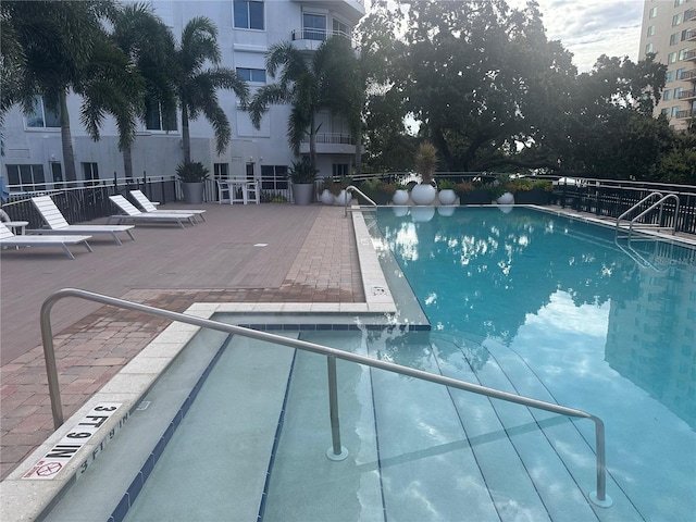 view of pool featuring a patio area