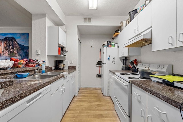 kitchen featuring sink, white appliances, white cabinets, and light wood-type flooring