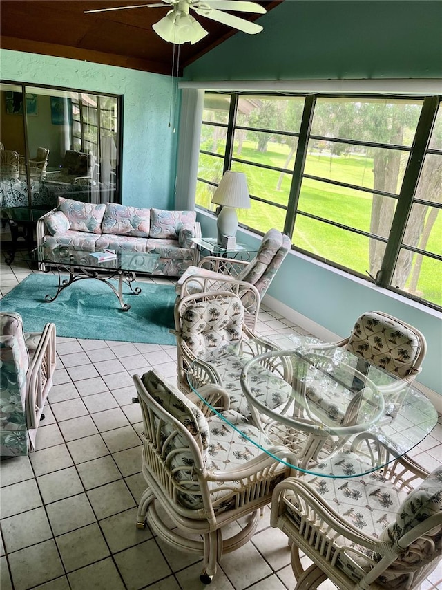 sunroom with ceiling fan and plenty of natural light