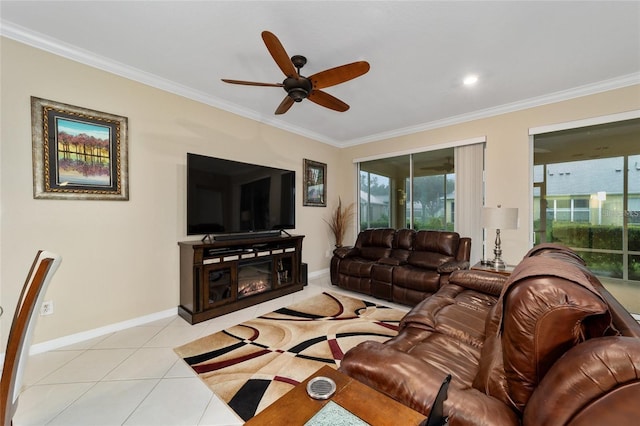 tiled living room with ceiling fan and crown molding