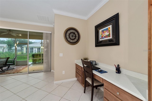 office space featuring ceiling fan, built in desk, crown molding, and light tile patterned floors